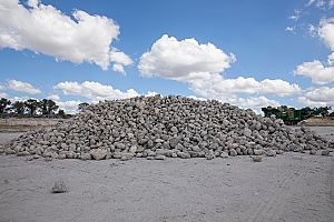 a pile of rock aggregates on a mining site