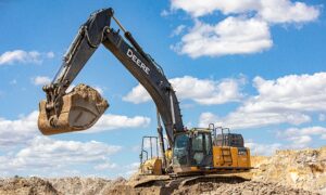 excavator picking up screened fill dirt