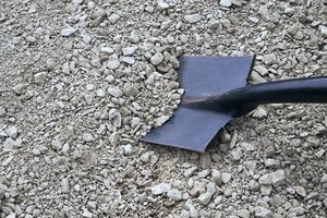 Uneven gravel aggregate and spade