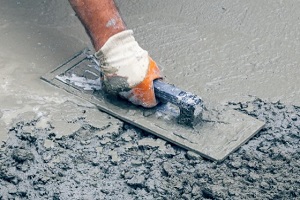 man plaining concrete floor