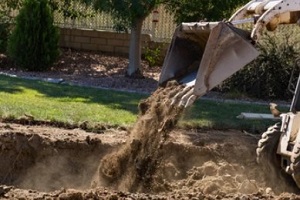 jcb putting dirt in backyard