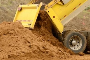 machine unloading fill dirt