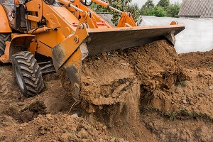 machine working with fill dirt