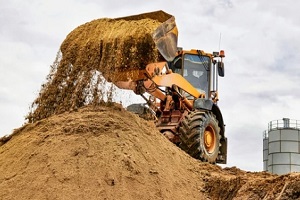 big machine lifting construction sand