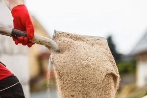 Southwestern Florida construction worker filtering sand