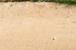 golf ball on sand