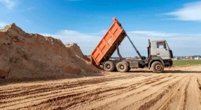 delivery of sand to the construction site by truck with raised body