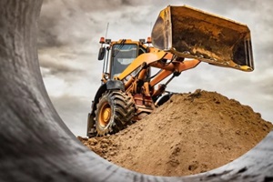 wheel loader or bulldozer working on a quarry or construction site