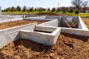 concrete foundation with reinforcement and metal slab construction site, process of house building