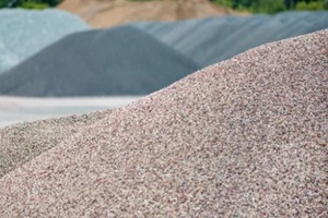 large piles of construction sand and gravel used for asphalt production and building