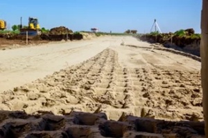 trace of huge road roller with spikes to compact fill dirt at Punta Gorda, FL construction site