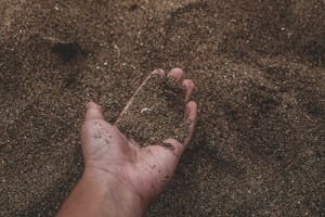 Person Holding Construction Sand in Hand from Punta Gorda quarry site