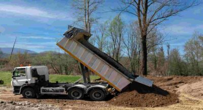 Dump Truck Unloading Fill Dirt at Fort Myers, FL Construction Site