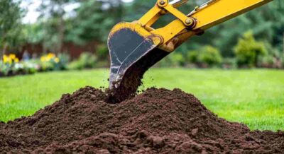 Excavator Digging into Fill Dirt in Punta Gorda, FL Park