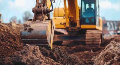Yellow Excavator Digging into Fill Dirt at Punta Gorda, FL Construction Site