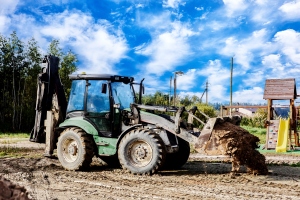 Loader Placing Fill Dirt on Construction Site