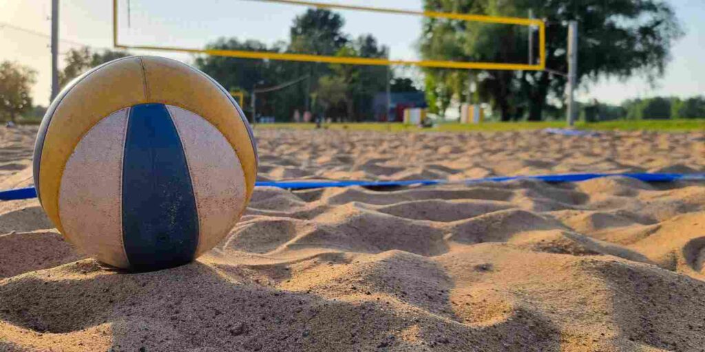 Ball Placed on Professional Grade Sand Volleyball Court